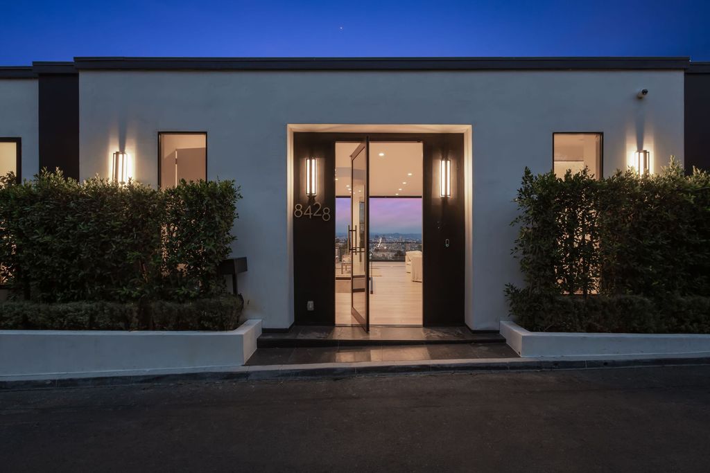 The Hollywood Hills Home is the pinnacle of luxury living showcasing unmatched explosive jetliner views now available for sale. This home located at 8428 Carlton Way, Los Angeles, California; offering 4 bedrooms and 6 bathrooms with over 5,300 square feet of living spaces.