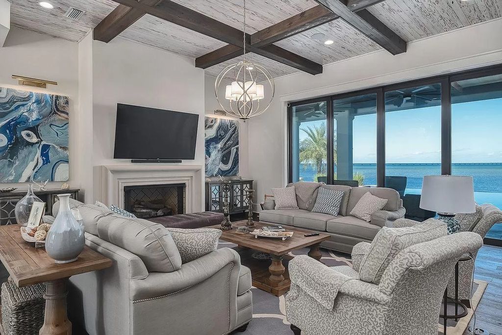 The Florida Retreat is a sprawling bay front home on premier homesites in the prestigious gated enclave of Regatta Bay now available for sale. This home located at 4532 Fairwind Ct, Destin, Florida; offering 4 bedrooms and 6 bathrooms with over 5,700 square feet of living spaces.