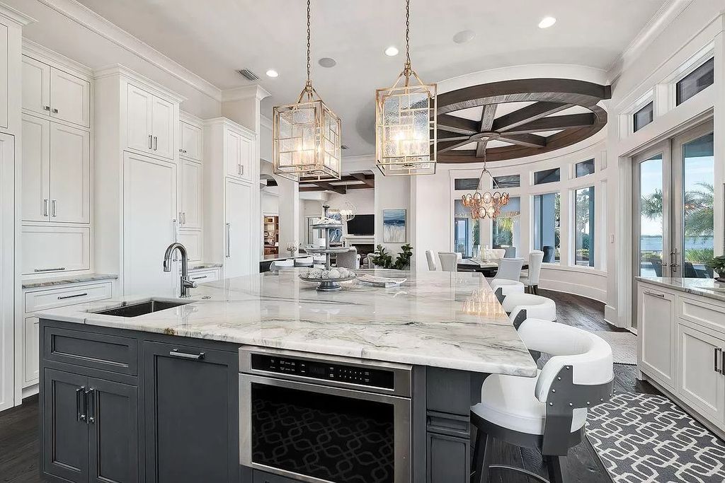 The Florida Retreat is a sprawling bay front home on premier homesites in the prestigious gated enclave of Regatta Bay now available for sale. This home located at 4532 Fairwind Ct, Destin, Florida; offering 4 bedrooms and 6 bathrooms with over 5,700 square feet of living spaces.