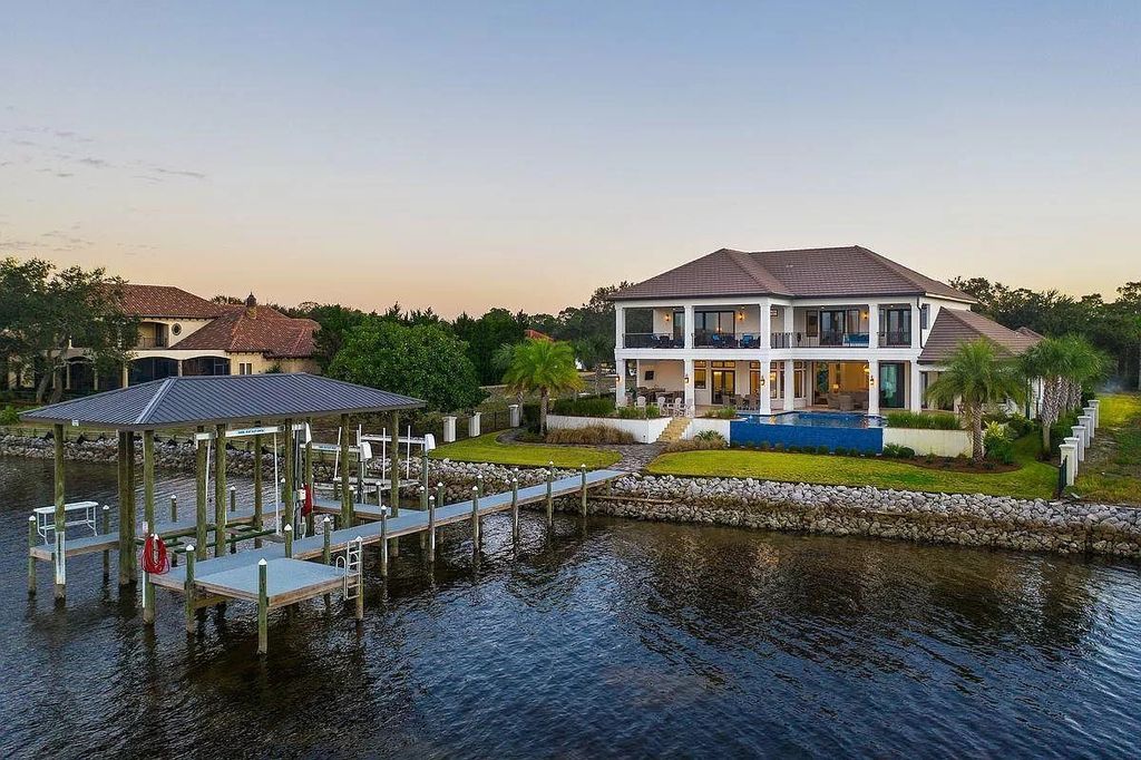 The Florida Retreat is a sprawling bay front home on premier homesites in the prestigious gated enclave of Regatta Bay now available for sale. This home located at 4532 Fairwind Ct, Destin, Florida; offering 4 bedrooms and 6 bathrooms with over 5,700 square feet of living spaces.