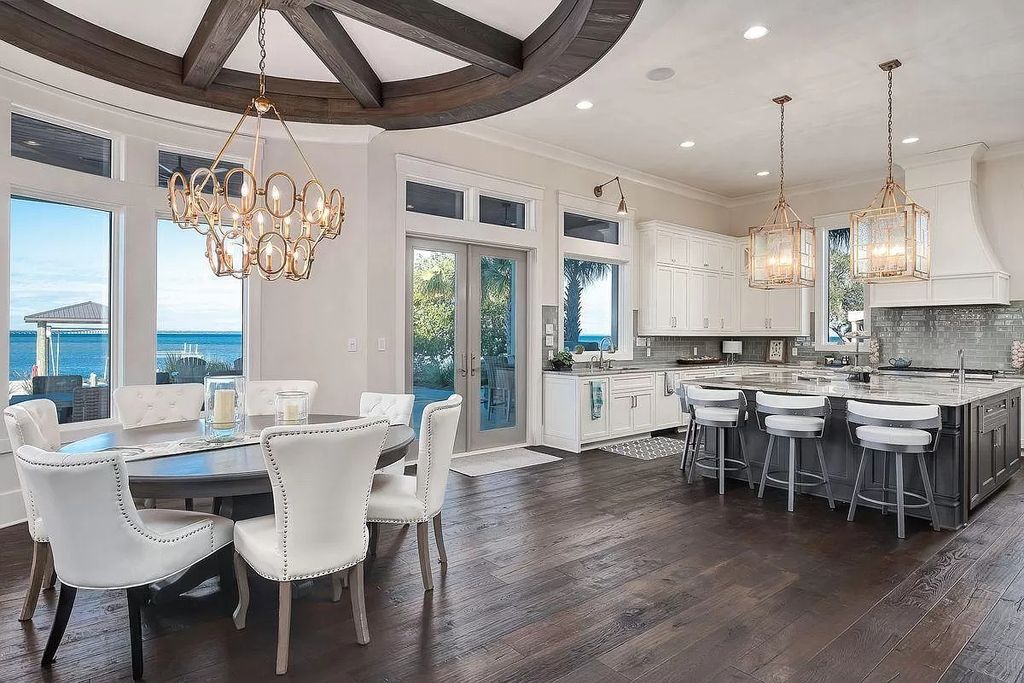 The Florida Retreat is a sprawling bay front home on premier homesites in the prestigious gated enclave of Regatta Bay now available for sale. This home located at 4532 Fairwind Ct, Destin, Florida; offering 4 bedrooms and 6 bathrooms with over 5,700 square feet of living spaces.