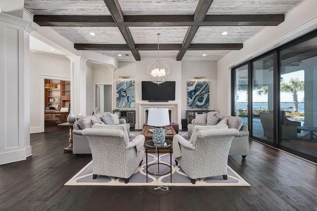 The Florida Retreat is a sprawling bay front home on premier homesites in the prestigious gated enclave of Regatta Bay now available for sale. This home located at 4532 Fairwind Ct, Destin, Florida; offering 4 bedrooms and 6 bathrooms with over 5,700 square feet of living spaces.