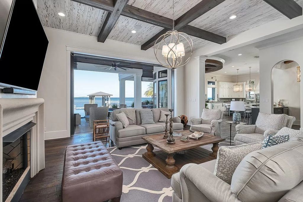 The Florida Retreat is a sprawling bay front home on premier homesites in the prestigious gated enclave of Regatta Bay now available for sale. This home located at 4532 Fairwind Ct, Destin, Florida; offering 4 bedrooms and 6 bathrooms with over 5,700 square feet of living spaces.