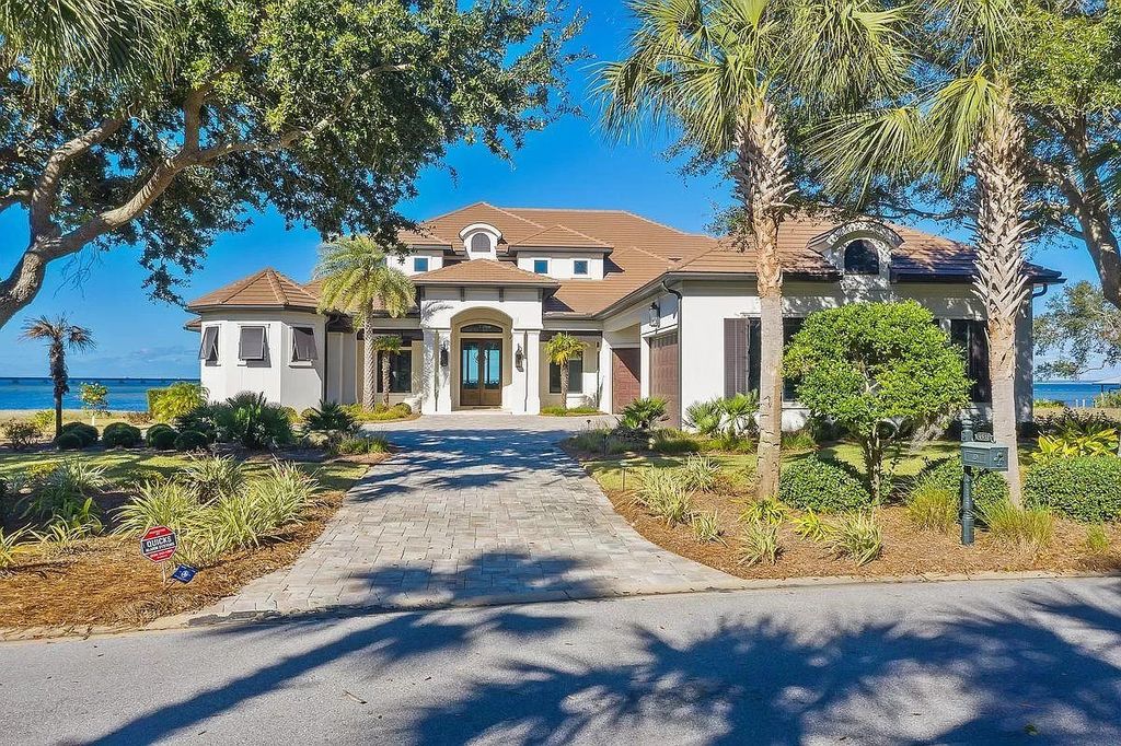 The Florida Retreat is a sprawling bay front home on premier homesites in the prestigious gated enclave of Regatta Bay now available for sale. This home located at 4532 Fairwind Ct, Destin, Florida; offering 4 bedrooms and 6 bathrooms with over 5,700 square feet of living spaces.