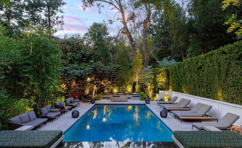 The Hollywood Hills Home is a zen-inspired architectural gem Located on a quiet, gated cul-de-sac lot is surrounded by trees, mature landscaping now available for sale. This home located at 7631 Willow Glen Rd, Los Angeles, California; offering 6 bedrooms and 8 bathrooms with over 10,000 square feet of living spaces.