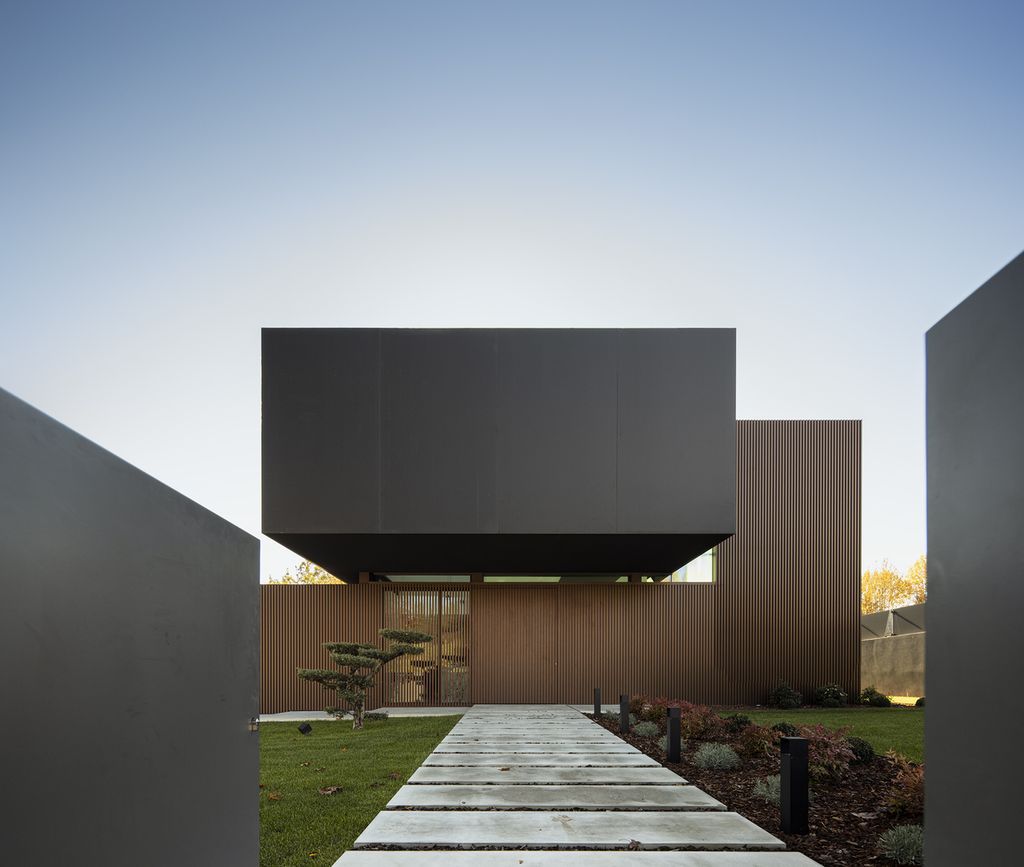 Masterful RCR House in Portugal was designed by Visioarq Arquitectos in contemporary style with concept of balance and contemplation; The spaces developed to create constant and distinct relationships between interior and exterior, with light entering where they merge.