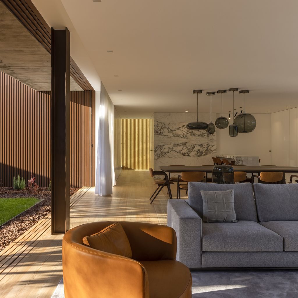 Masterful RCR House in Portugal was designed by Visioarq Arquitectos in contemporary style with concept of balance and contemplation; The spaces developed to create constant and distinct relationships between interior and exterior, with light entering where they merge.