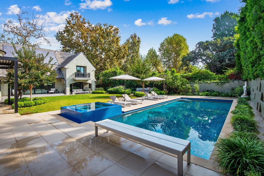 The Home in Los Angeles is an absolutely breathtaking property perfects for outdoor entertaining with the cozy loggia & fireplace now available for sale. This home located at 383 S Beverly Glen Blvd, Los Angeles, California; offering 6 bedrooms and 8 bathrooms with over 7,000 square feet of living spaces.