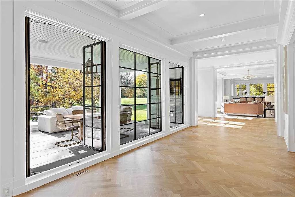 The New York Estate is an architectural trophy property juxtaposes clean modern lines and open living spaces now available for sale. This home located at 70 Bacon Rd, Old Westbury, New York; offering 6 bedrooms and 7 bathrooms with over 10,700 square feet of living spaces. 
