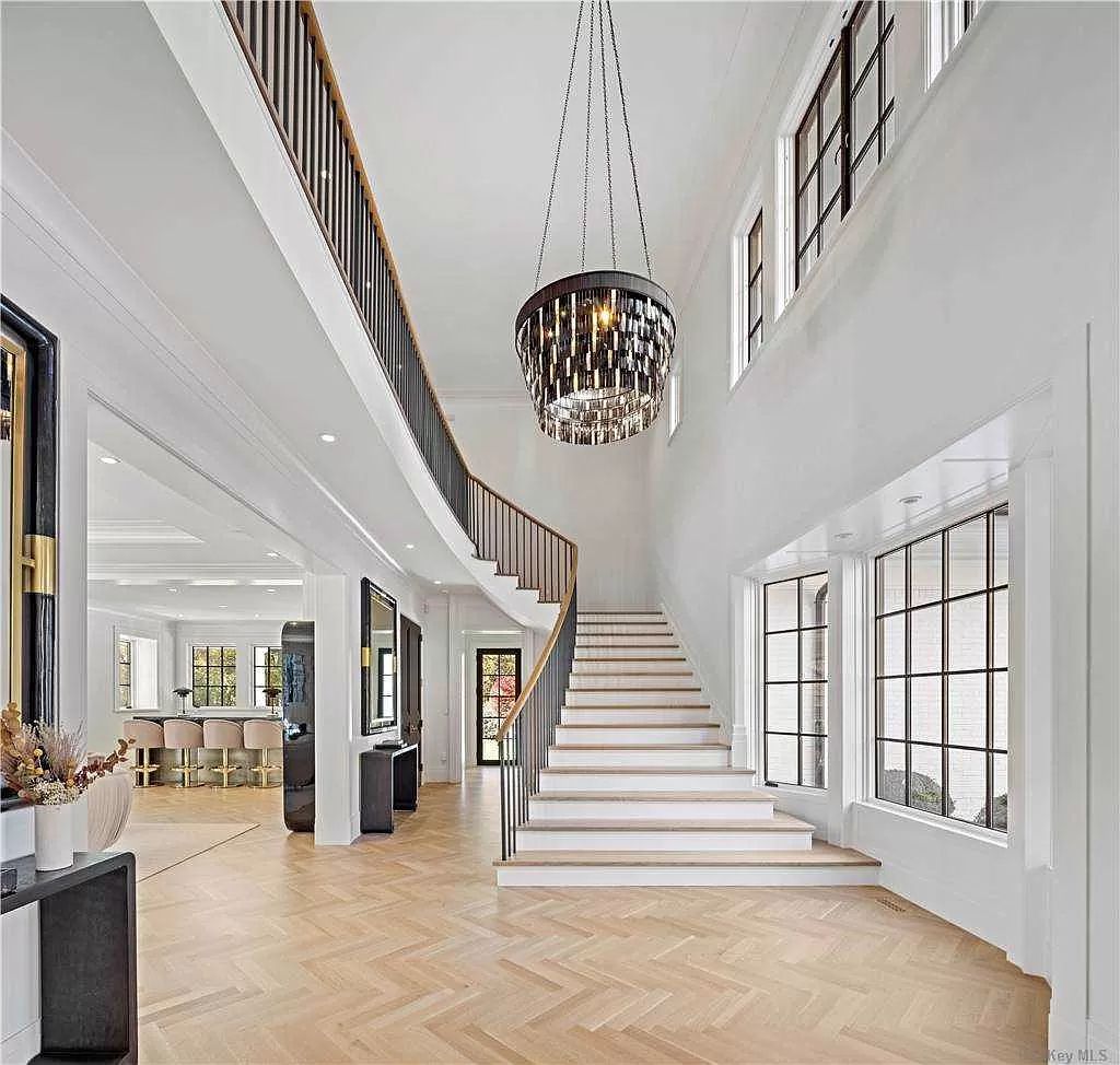 The New York Estate is an architectural trophy property juxtaposes clean modern lines and open living spaces now available for sale. This home located at 70 Bacon Rd, Old Westbury, New York; offering 6 bedrooms and 7 bathrooms with over 10,700 square feet of living spaces. 
