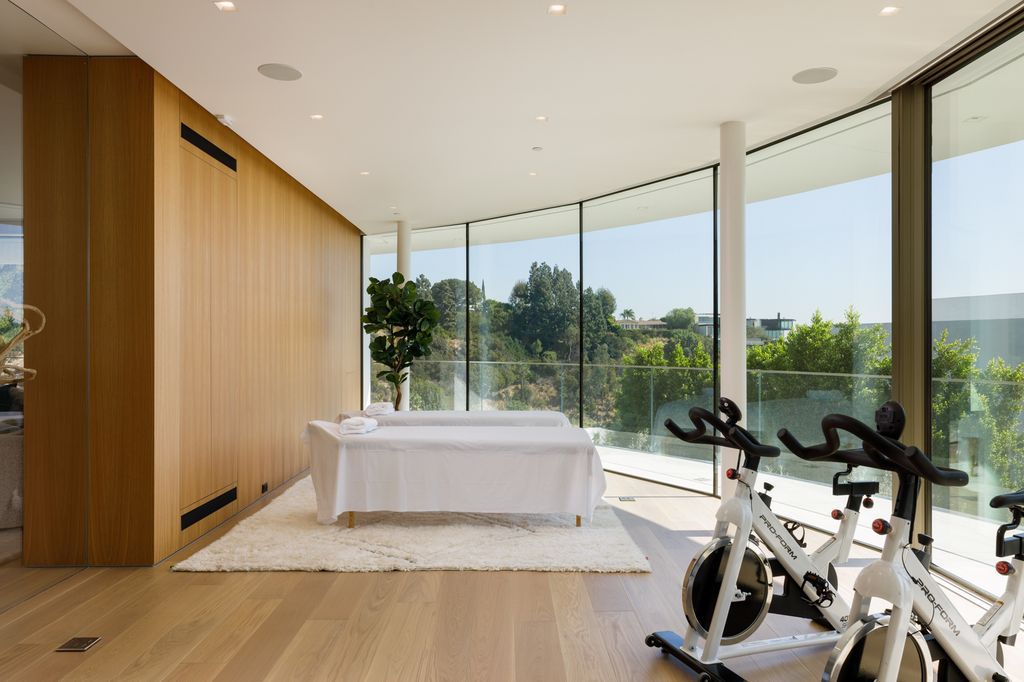 The Hollywood Hills Mansion is an amenity-rich entertainer’s paradise within walking distance to the iconic Sunset Strip now available for sale. This home located at 1422 Devlin Dr, Los Angeles, California; offering 6 bedrooms and 10 bathrooms with over 10,000 square feet of living spaces.