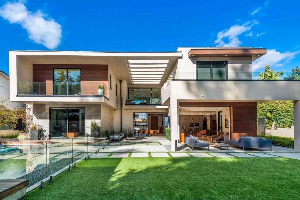 The Encino Home is a modern masterpiece in Royal Hills, sitting on a cul-de-sac with valley views now available for sale. This home located at 16102 Sandy Ln, Encino, California; offering 5 bedrooms and 6 bathrooms with over 5,300 square feet of living spaces.