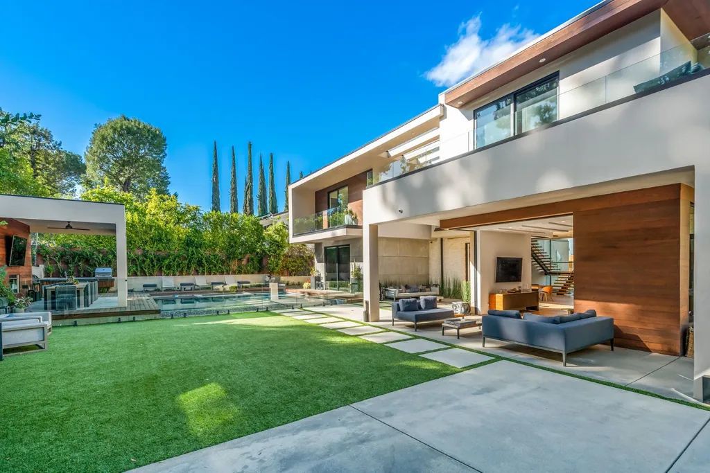 The Encino Home is a modern masterpiece in Royal Hills, sitting on a cul-de-sac with valley views now available for sale. This home located at 16102 Sandy Ln, Encino, California; offering 5 bedrooms and 6 bathrooms with over 5,300 square feet of living spaces.