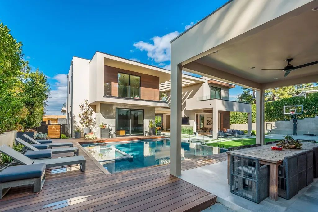 The Encino Home is a modern masterpiece in Royal Hills, sitting on a cul-de-sac with valley views now available for sale. This home located at 16102 Sandy Ln, Encino, California; offering 5 bedrooms and 6 bathrooms with over 5,300 square feet of living spaces.