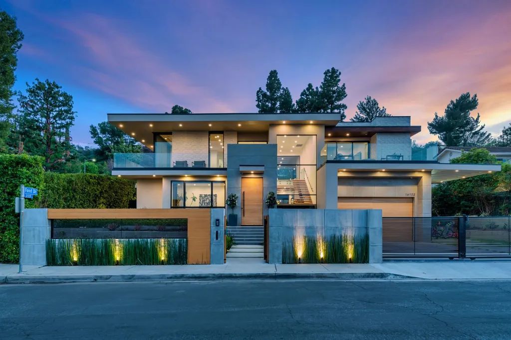 The Encino Home is a modern masterpiece in Royal Hills, sitting on a cul-de-sac with valley views now available for sale. This home located at 16102 Sandy Ln, Encino, California; offering 5 bedrooms and 6 bathrooms with over 5,300 square feet of living spaces.