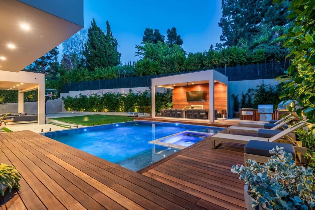 The Encino Home is a modern masterpiece in Royal Hills, sitting on a cul-de-sac with valley views now available for sale. This home located at 16102 Sandy Ln, Encino, California; offering 5 bedrooms and 6 bathrooms with over 5,300 square feet of living spaces.