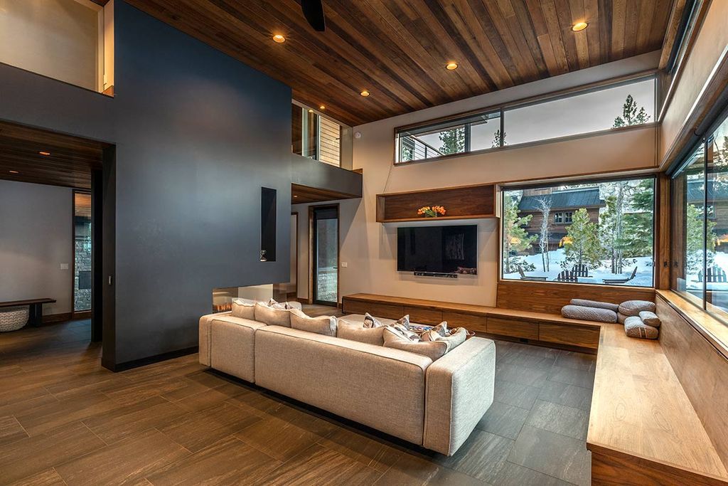 The Martis Camp Home is simultaneously airy and wide open while also being peaceful and private now available for sale. This home located at 8378 Thunderbird Cir, Truckee, California; offering 5 bedrooms and 4 bathrooms with over 3,200 square feet of living spaces.
