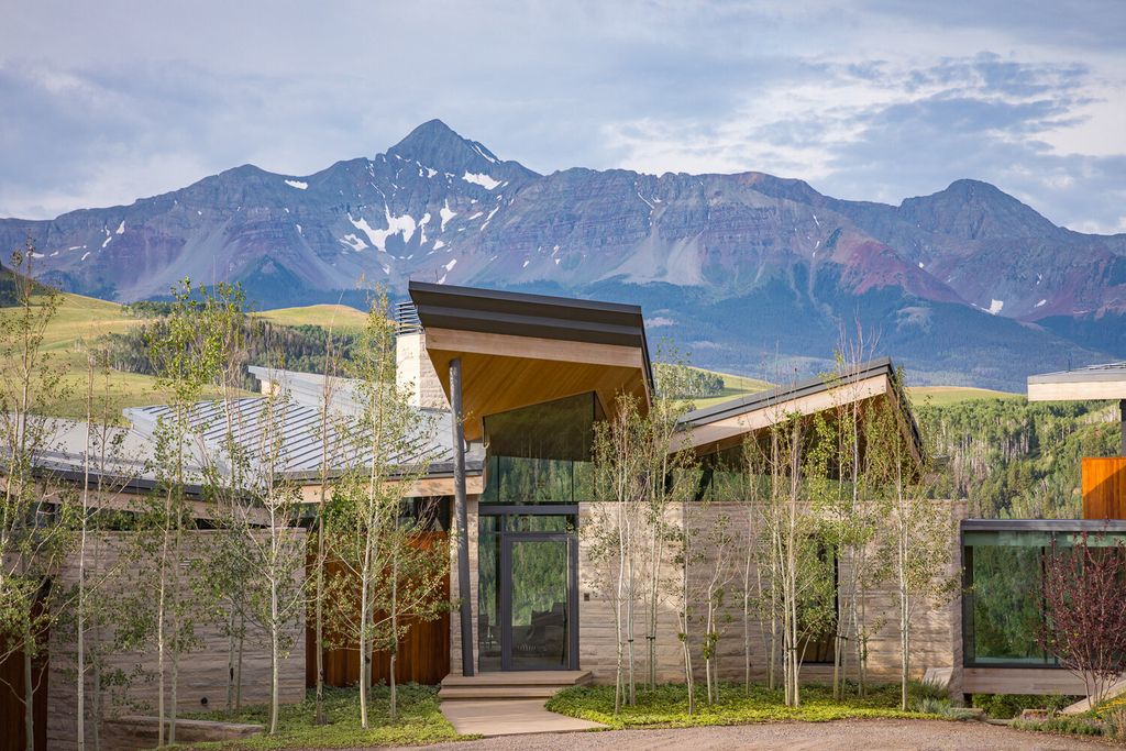 The Colorado Mansion is a modern architectural masterpiece is perched on a point featuring thrilling views of Telluride's most dramatic peaks now available for sale. This home located at 296 Gray Head Ln, Telluride, Colorado; offering 6 bedrooms and 10 bathrooms with over 11,800 square feet of living spaces.