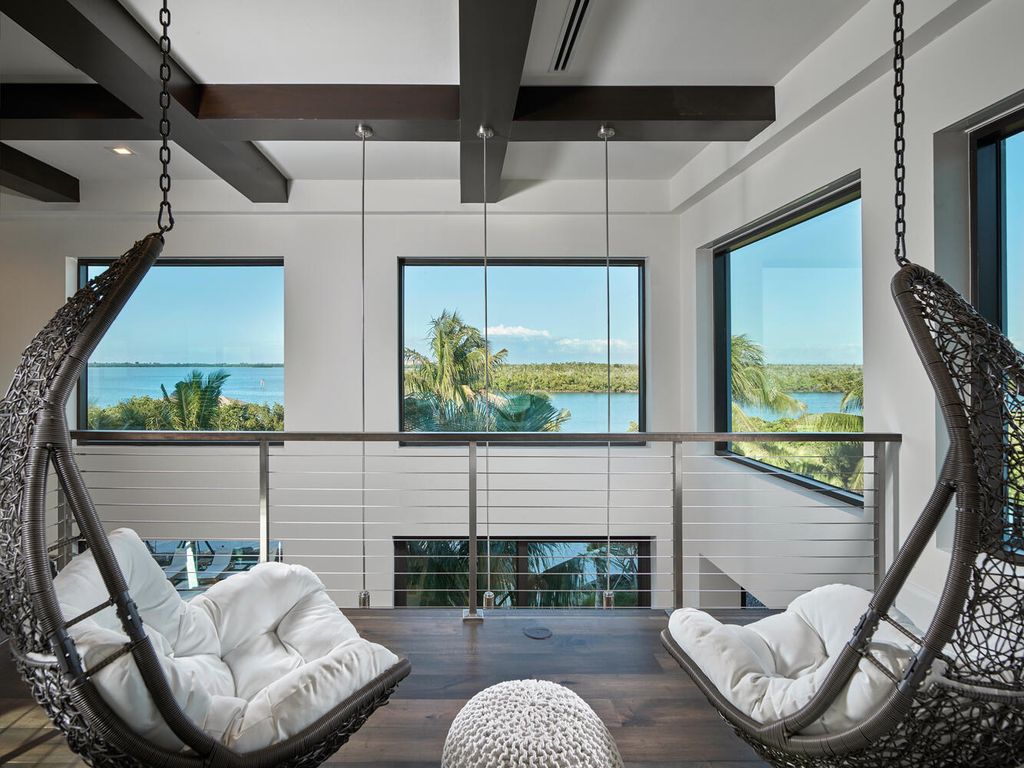 The Home on Marco Island is a Incredible island sanctuary nestled along the natural shoreline of Barfield Bay now available for sale. This home located at 899 Caxambas Dr, Marco Island, Florida; offering 5 bedrooms and 5 bathrooms with over 6,000 square feet of living spaces.