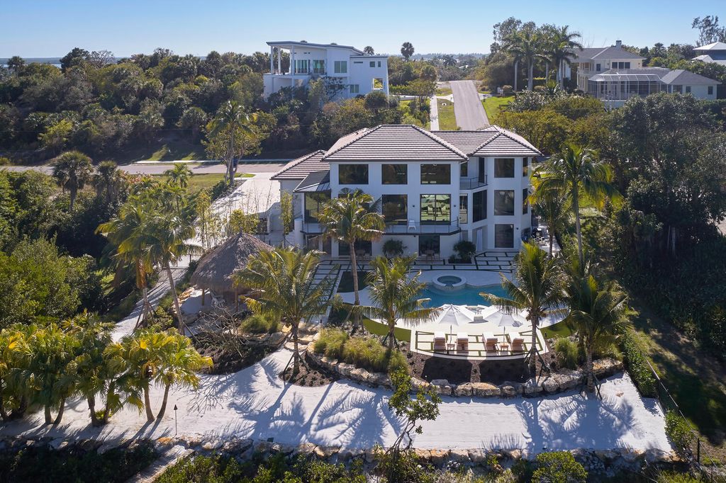 The Home on Marco Island is a Incredible island sanctuary nestled along the natural shoreline of Barfield Bay now available for sale. This home located at 899 Caxambas Dr, Marco Island, Florida; offering 5 bedrooms and 5 bathrooms with over 6,000 square feet of living spaces.