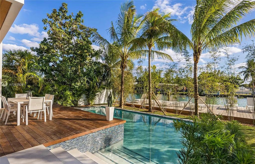 The Miami Beach Home is a new construction modern masterpiece located within the serene gated community of Normandy Isle now available for sale. This home located at 770 S Shore Dr, Miami Beach, Florida; offering 4 bedrooms and 5 bathrooms with over 5,000 square feet of living spaces.