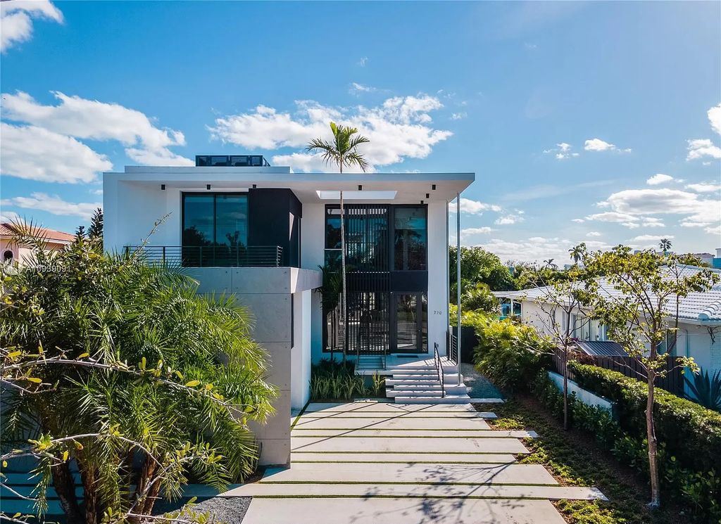 The Miami Beach Home is a new construction modern masterpiece located within the serene gated community of Normandy Isle now available for sale. This home located at 770 S Shore Dr, Miami Beach, Florida; offering 4 bedrooms and 5 bathrooms with over 5,000 square feet of living spaces.