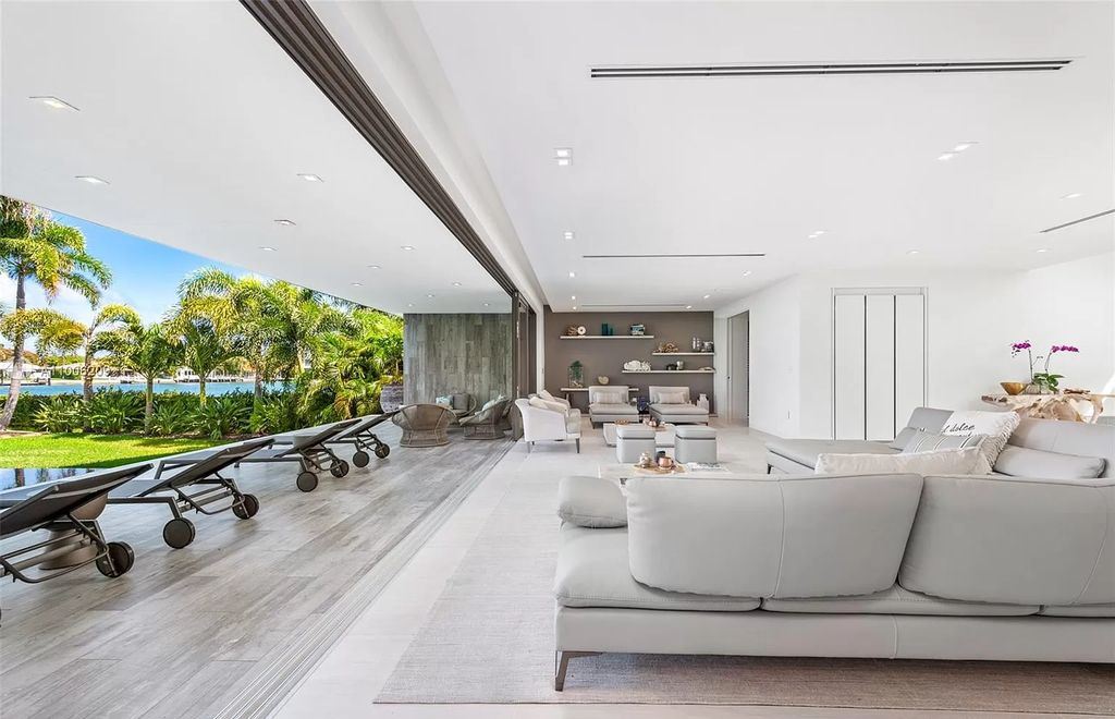 The Waterfront Home in Miami Beach is a new construction masterpiece located in gated community of Normandy Shores now available for sale. This home located at 305 N Shore Dr, Miami Beach, Florida; offering 5 bedrooms and 8 bathrooms with over 5,233 square feet of living spaces.