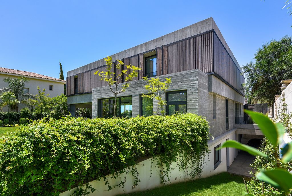 Concrete House in Cyprus was designed by Markella Menikou Chartered Architect in contemporary style with seamless extension to the outside; this house offers modern living with high end finishes and smart amenities. 