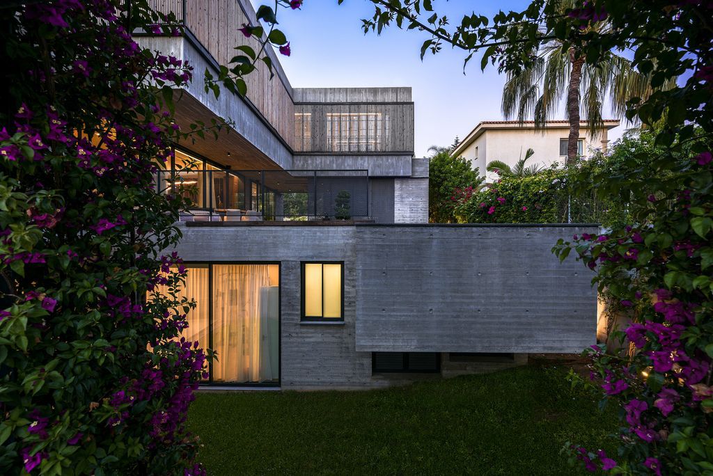 Concrete House in Cyprus was designed by Markella Menikou Chartered Architect in contemporary style with seamless extension to the outside; this house offers modern living with high end finishes and smart amenities. 