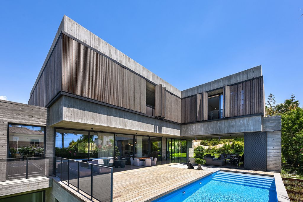 Concrete House in Cyprus was designed by Markella Menikou Chartered Architect in contemporary style with seamless extension to the outside; this house offers modern living with high end finishes and smart amenities. 