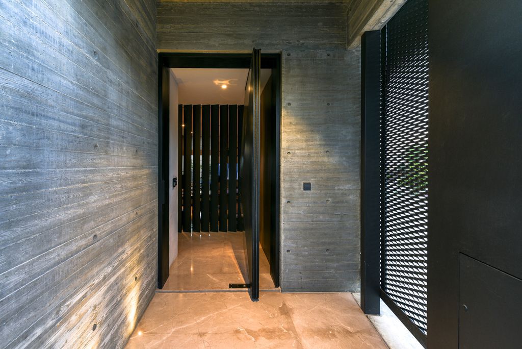 Concrete House in Cyprus was designed by Markella Menikou Chartered Architect in contemporary style with seamless extension to the outside; this house offers modern living with high end finishes and smart amenities. 