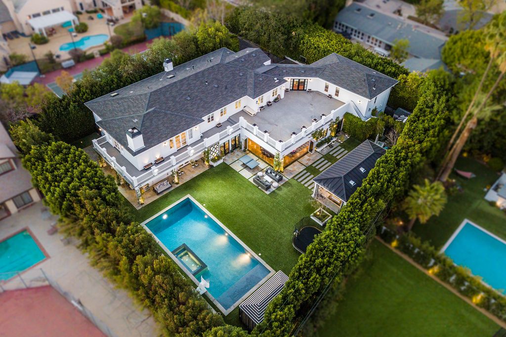 The Encino Estate is a opulent architectural masterpiece tucked behind exclusive private gates now available for sale. This home located at 4848 Encino Ave, Encino, California; offering 7 bedrooms and 9 bathrooms with over 10,500 square feet of living spaces.