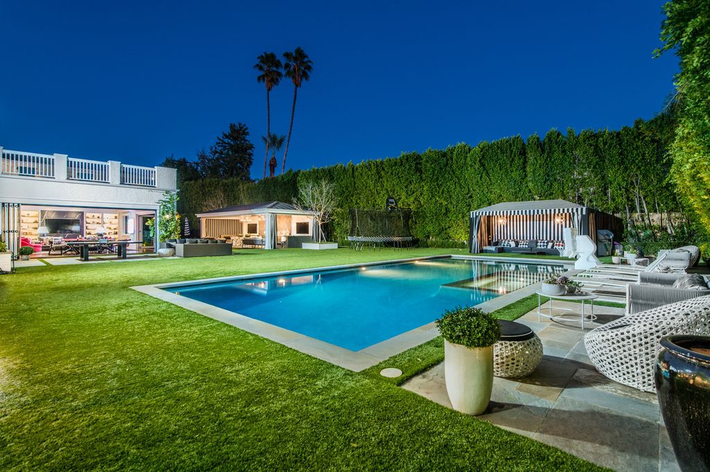 The Encino Estate is a opulent architectural masterpiece tucked behind exclusive private gates now available for sale. This home located at 4848 Encino Ave, Encino, California; offering 7 bedrooms and 9 bathrooms with over 10,500 square feet of living spaces.