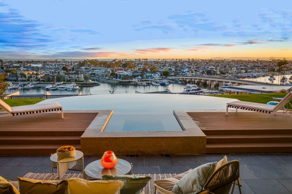 The California Contemporary Home is a luxuriously newly constructed residence with panoramic vistas of Newport Harbor now available for sale. This home located at 1215 Dolphin Ter, Corona Del Mar, California; offering 6 bedrooms and 8 bathrooms with over 7,200 square feet of living spaces.