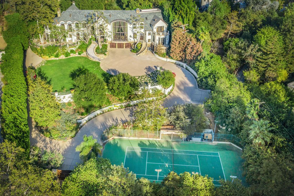 The Beverly Hills Mansion is a palatial estate boasts 13,405 square feet of unmatched scale and style now available for sale. This home located at 2650 Benedict Canyon Dr, Beverly Hills, California; offering 7 bedrooms and 9 bathrooms with over 13,000 square feet of living spaces.