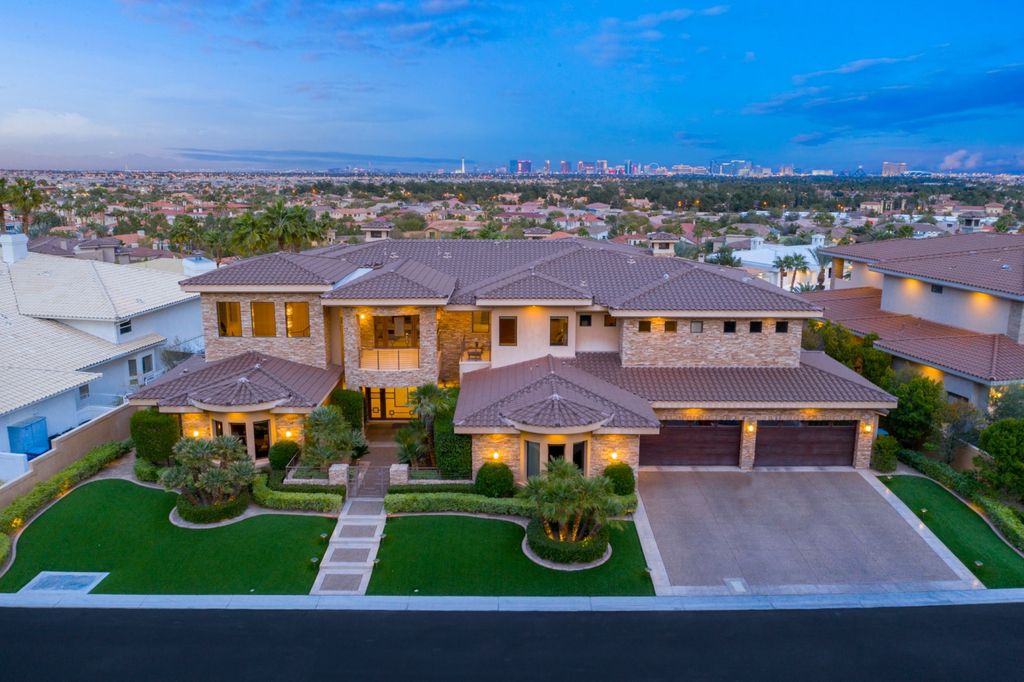 The Home in Las Vegas is a luxurious property situated in a sought-after gated community has the air of a private luxury resort now available for sale. This home located at 5128 Scenic Ridge Dr, Las Vegas, Nevada; offering 5 bedrooms and 4 bathrooms with over 9,700 square feet of living spaces.