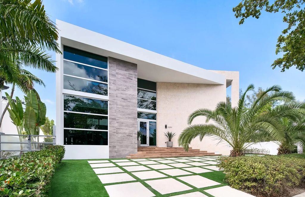 The Home in Miami Beach is a modern masterpiece with only the finest fixtures, finishes, and amenities now available for sale. This home located at 13250 Biscayne Bay Dr, North Miami, Florida; offering 5 bedrooms and 5 bathrooms with over 4,500 square feet of living spaces.