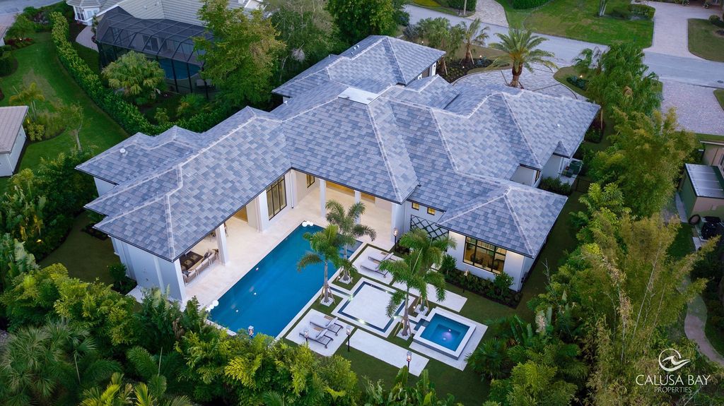The Contemporary Home is perfectly complemented by lush mature tropical landscaping in the heart of Pelican Bay now available for sale. This home located at 810 Bentwood Dr, Naples, Florida; offering 4 bedrooms and 6 bathrooms with over 4,600 square feet of living spaces.