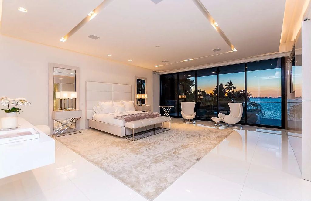 The Resort Style Mansion in Miami Beach is a newly luxurious home with sunsets over the Miami skyline on prestigious North bay road now available for sale. This home located at 5004 N Bay Rd, Miami Beach, Florida; offering 8 bedrooms and 10 bathrooms with over 12,800 square feet of living spaces. 