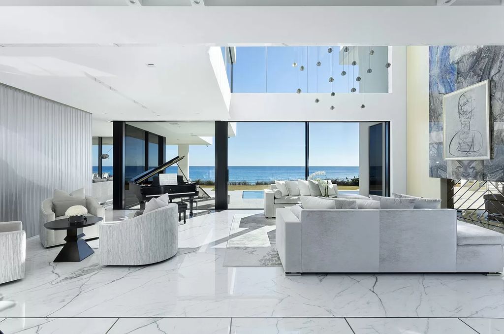 The Modern Mansion in Highland Beach is a gated modern Malibu-inspired ocean to intracoastal Estate now available for sale. This home located at 3833 S Ocean Blvd, Highland Beach, Florida; offering 5 bedrooms and 9 bathrooms with over 8,800 square feet of living spaces.