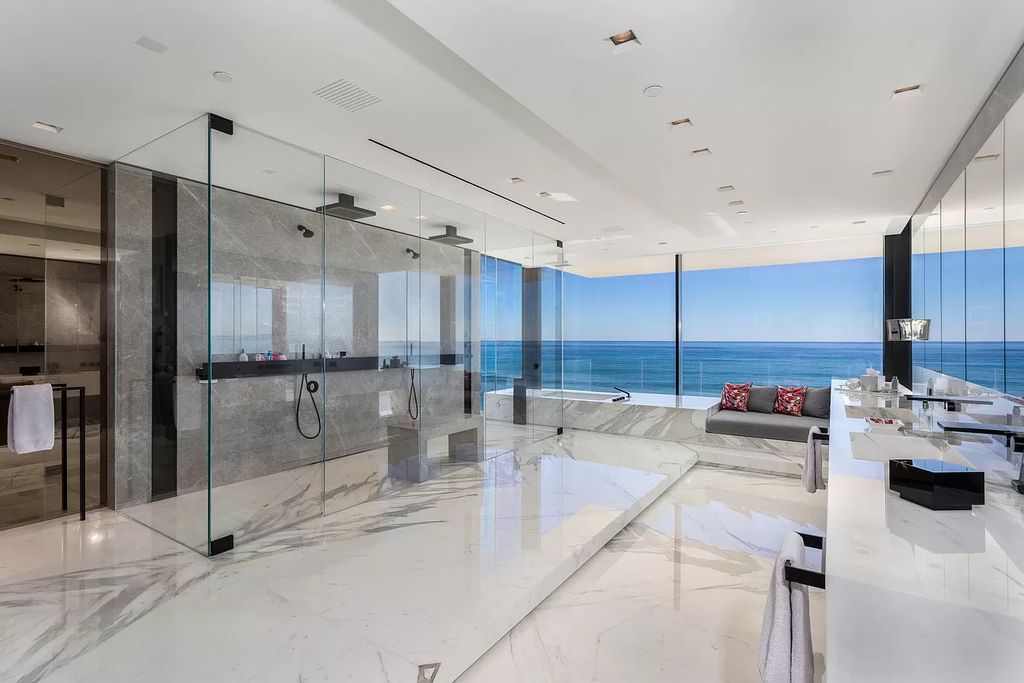 The Modern Mansion in Highland Beach is a gated modern Malibu-inspired ocean to intracoastal Estate now available for sale. This home located at 3833 S Ocean Blvd, Highland Beach, Florida; offering 5 bedrooms and 9 bathrooms with over 8,800 square feet of living spaces.