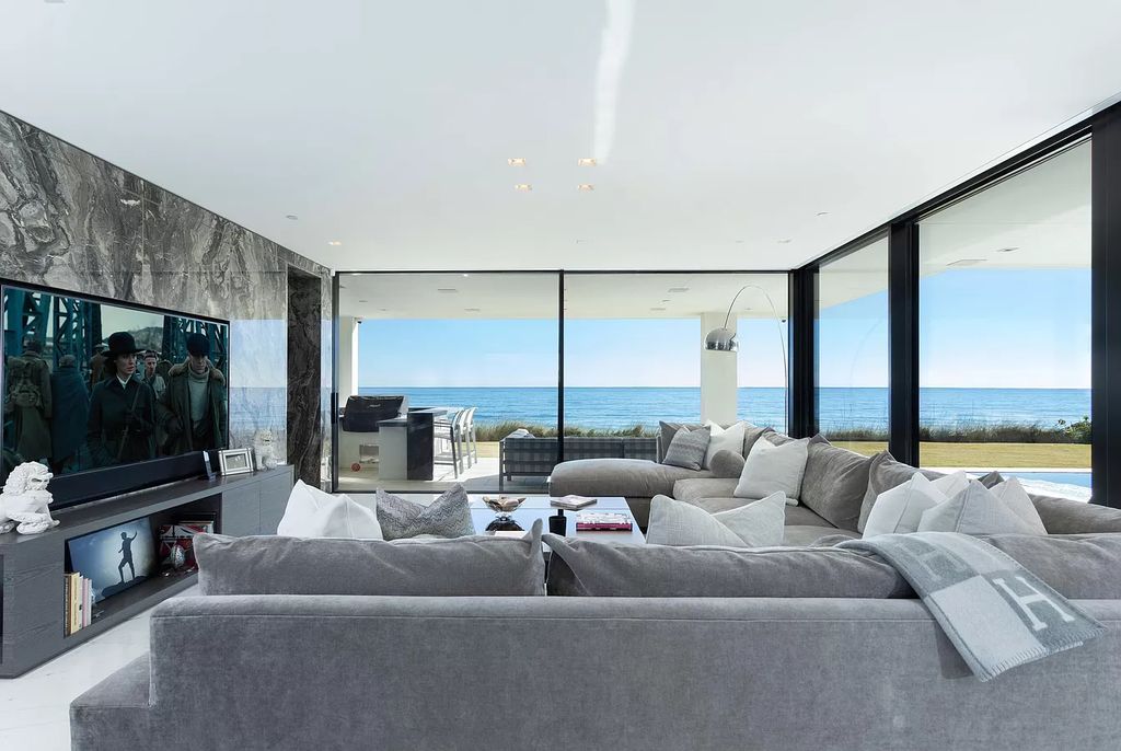 The Modern Mansion in Highland Beach is a gated modern Malibu-inspired ocean to intracoastal Estate now available for sale. This home located at 3833 S Ocean Blvd, Highland Beach, Florida; offering 5 bedrooms and 9 bathrooms with over 8,800 square feet of living spaces.