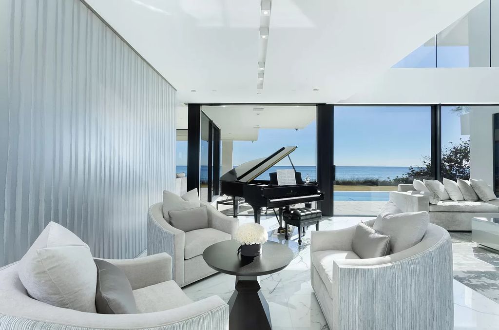 The Modern Mansion in Highland Beach is a gated modern Malibu-inspired ocean to intracoastal Estate now available for sale. This home located at 3833 S Ocean Blvd, Highland Beach, Florida; offering 5 bedrooms and 9 bathrooms with over 8,800 square feet of living spaces.