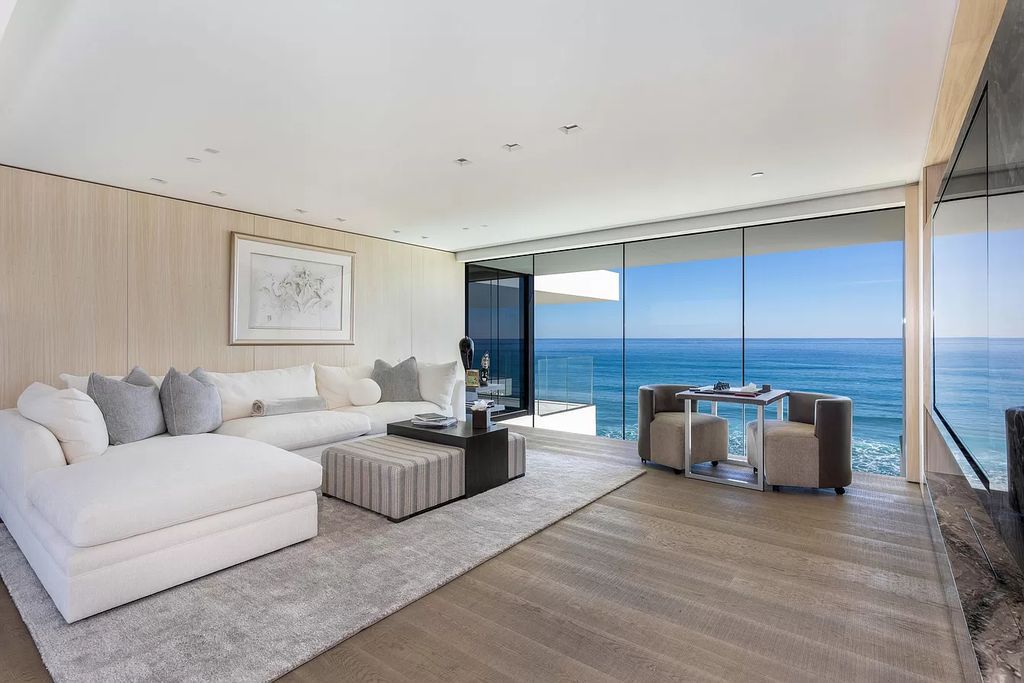 The Modern Mansion in Highland Beach is a gated modern Malibu-inspired ocean to intracoastal Estate now available for sale. This home located at 3833 S Ocean Blvd, Highland Beach, Florida; offering 5 bedrooms and 9 bathrooms with over 8,800 square feet of living spaces.