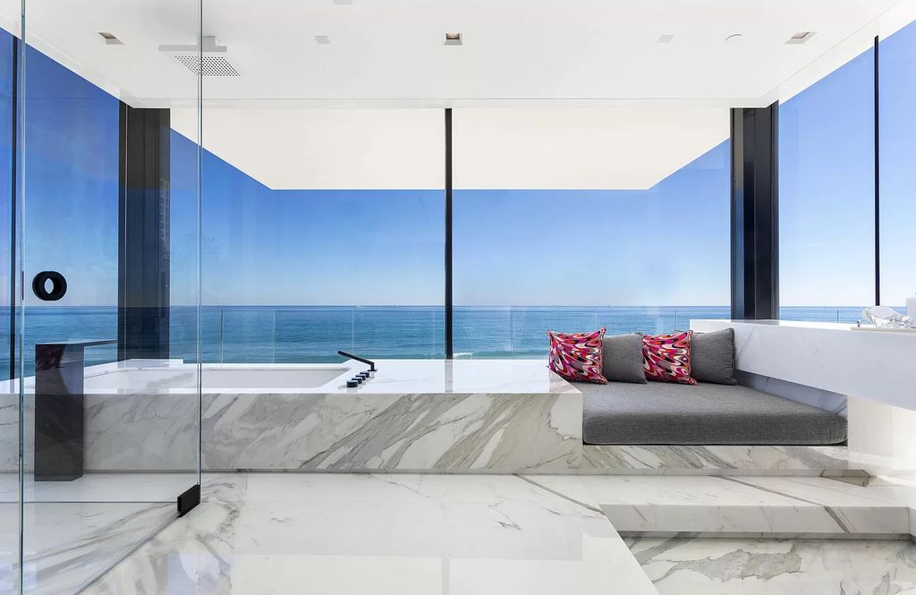 The Modern Mansion in Highland Beach is a gated modern Malibu-inspired ocean to intracoastal Estate now available for sale. This home located at 3833 S Ocean Blvd, Highland Beach, Florida; offering 5 bedrooms and 9 bathrooms with over 8,800 square feet of living spaces.