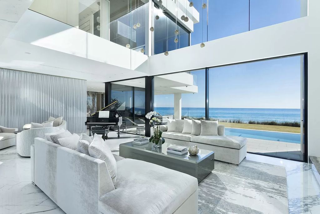 The Modern Mansion in Highland Beach is a gated modern Malibu-inspired ocean to intracoastal Estate now available for sale. This home located at 3833 S Ocean Blvd, Highland Beach, Florida; offering 5 bedrooms and 9 bathrooms with over 8,800 square feet of living spaces.