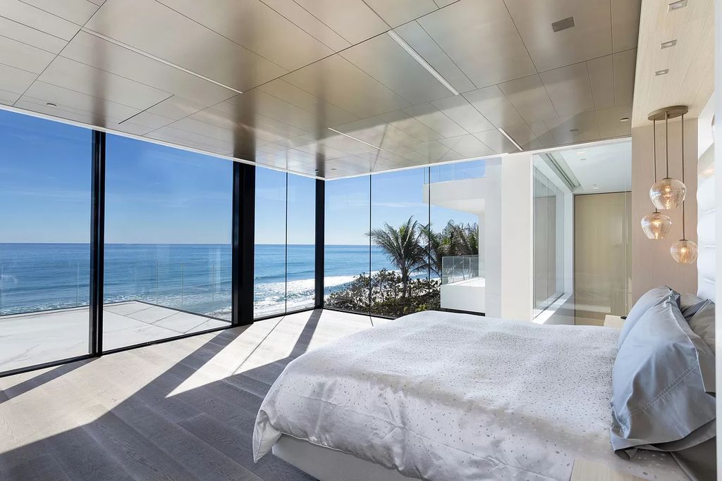 The Modern Mansion in Highland Beach is a gated modern Malibu-inspired ocean to intracoastal Estate now available for sale. This home located at 3833 S Ocean Blvd, Highland Beach, Florida; offering 5 bedrooms and 9 bathrooms with over 8,800 square feet of living spaces.