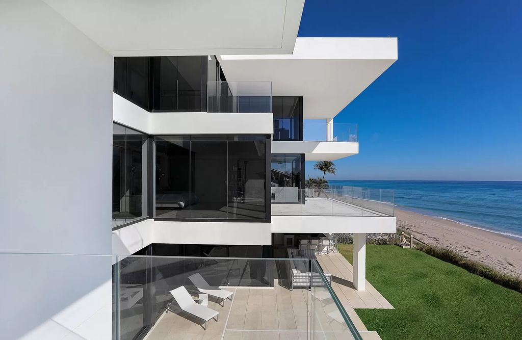 The Modern Mansion in Highland Beach is a gated modern Malibu-inspired ocean to intracoastal Estate now available for sale. This home located at 3833 S Ocean Blvd, Highland Beach, Florida; offering 5 bedrooms and 9 bathrooms with over 8,800 square feet of living spaces.