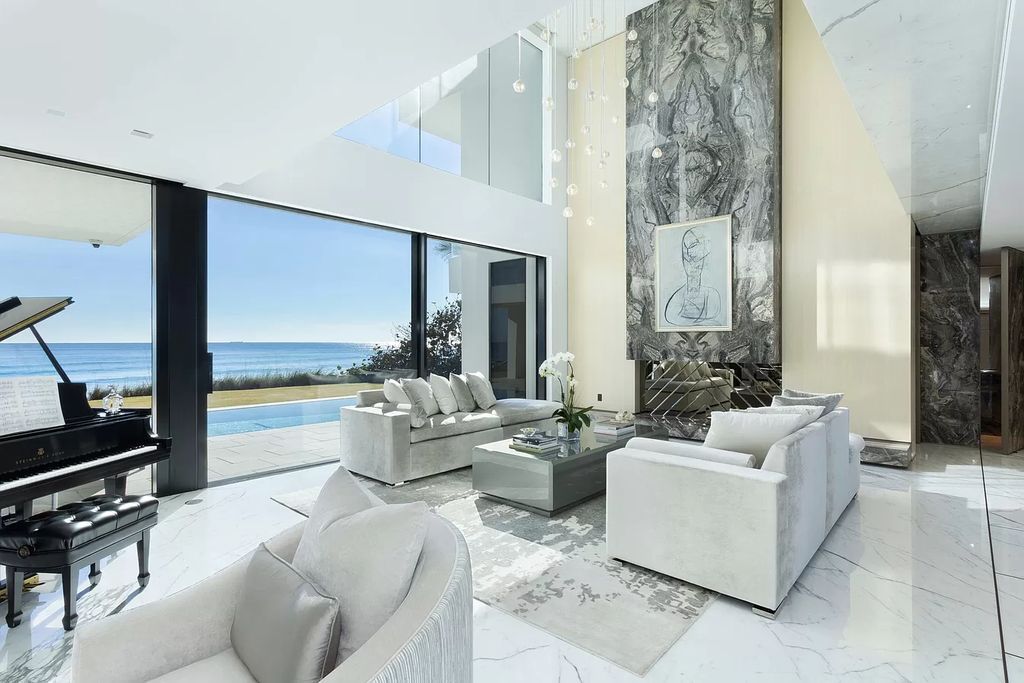 The Modern Mansion in Highland Beach is a gated modern Malibu-inspired ocean to intracoastal Estate now available for sale. This home located at 3833 S Ocean Blvd, Highland Beach, Florida; offering 5 bedrooms and 9 bathrooms with over 8,800 square feet of living spaces.