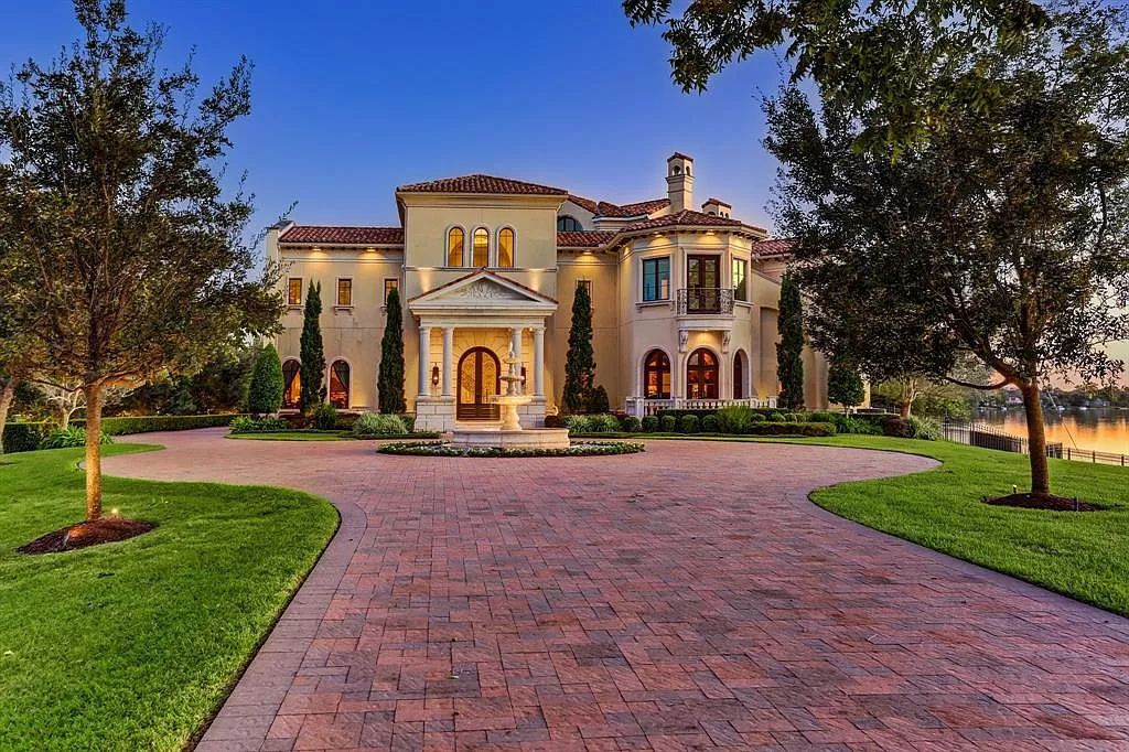The Waterfront Home in Sugar Land is a palatial estate sits on its own private gated peninsula surrounded by water now available for sale. This home located at 11 Paradise Point Dr, Sugar Land, Texas; offering 6 bedrooms and 8 bathrooms with over 13,000 square feet of living spaces.